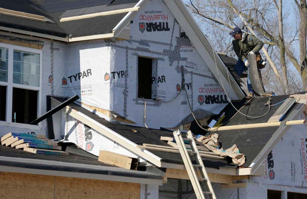 Nam Y. Huh / the Associated Press files
Removing old roofing material prior to installing a new roof is the best way to ensure the new roof has no leaks or other flaws.