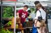 MIKAELA MACKENZIE / WINNIPEG FREE PRESS
Patrick Michalyshyn, owner of 1882 Hot Sauce, chats with customers at the Wolseley Farmers Market.