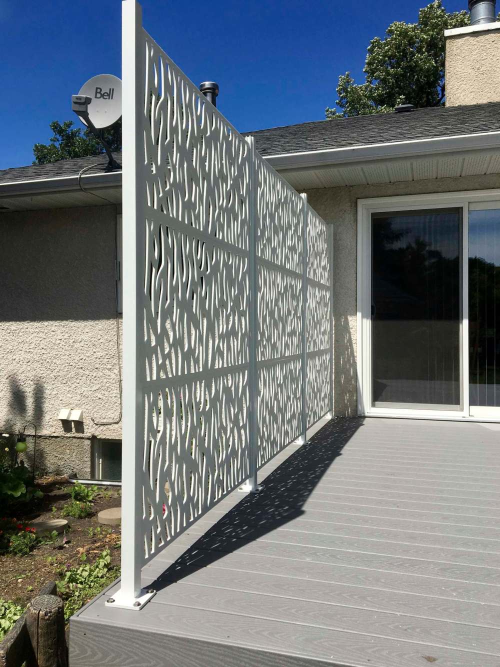 Four posts fitted with u-channel set equidistant from each other allow nine privacy panels to slide into three groups of three high providing six feet of privacy.
