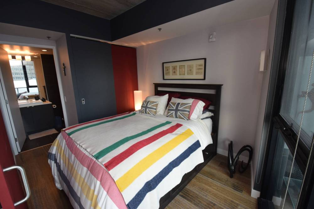 The primary bedroom can be closed off by a sliding door and comes with a luxurious three-piece ensuite and stunning view.