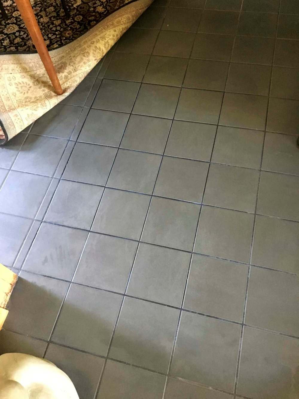 Photos by Marc LaBossiere / Winnipeg Free Press
The section of two rows of tiles that had loosened from the subfloor seemed to vanish from sight once the grout began to set.