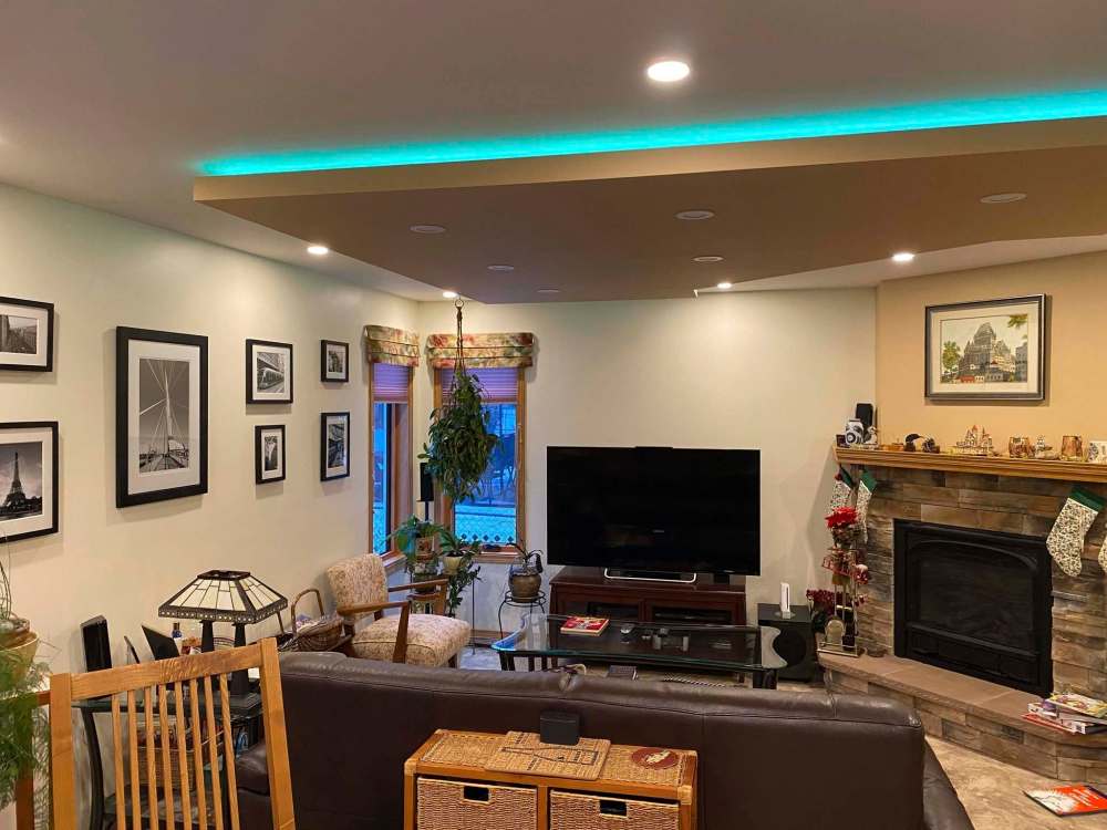 Photos by Marc LaBossiere / Winnipeg Free Press
Precise measurements were taken to design the shape of the tray ceiling, which incorporates the angles of the corner fireplace, and is set equidistant from all the living room walls.