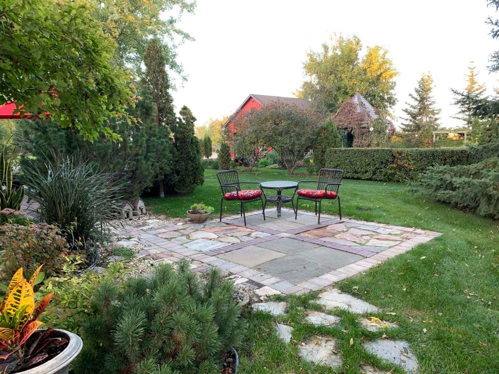 Salvaged brick and limestone was used to create this patio.