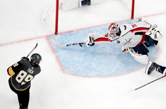 John Locher / The Associated PressWashington Capitals goaltender Braden Holtby, right, makes a stick save on shot by Vegas Golden Knights right wing Alex Tuch during Game 2.