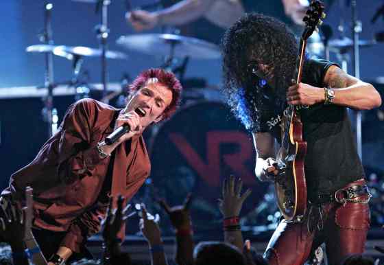 MARK J. TERRILL / The Associated Press FilesSinger Scott Weiland, left, in 2004 with Slash in Velvet Revolver. Weiland has died at the age of 48.