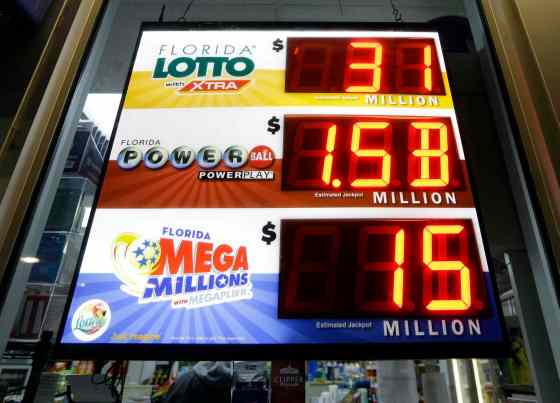 Alan Diaz / The Associated Press FilesA sign shows the Powerball jackpot at a gas station Tuesday in Miami.