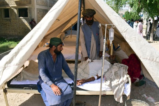 CPAn injured man is treated in a tent set up at a hospital after an earthquake in Harnai, Pakistan. (Arshad Butt / The Associated Press)
