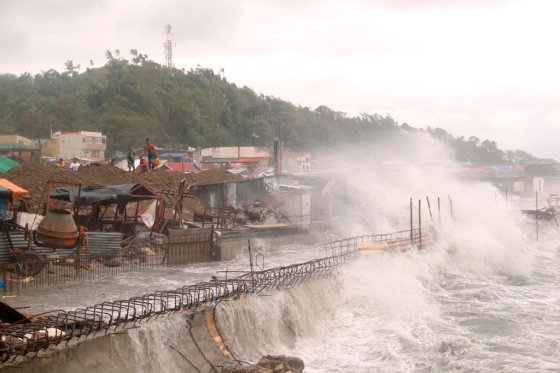 Simvale Sayat / The Associated PressStrong waves batter houses along the coastline of Catbalogan city, Western Samar province, eastern Philippines caused by typhoon Vongfong, Thursday.