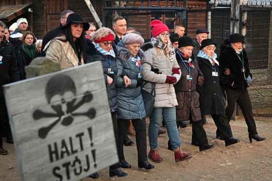 Czarek Sokolowski / The Associated PressPoland's President Andrzej Duda walks along with survivors through the gates of the Auschwitz Nazi concentration camp in Oswiecim, Poland, Monday.