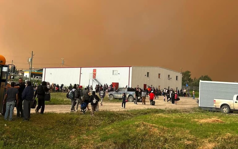 Residents of Pukatawagan prepare for evacuation on Thursday as a wildfire bears down on the northern First Nation. (Thompson Professional Firefighters Association photo)
