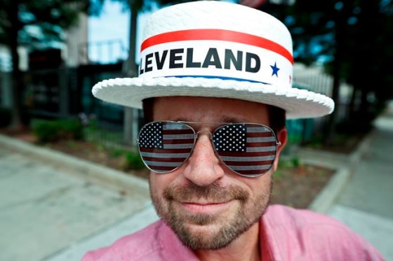 ALEX BRANDON / THE ASSOCIATED PRESSAndy Sandy wears an RNC hat and pair of American flag glasses while walking around in Cleveland. The Republican National Convention starts today.
