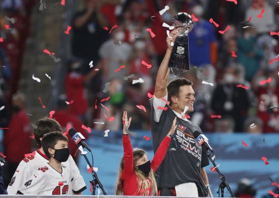 Tribune Media Stephen M. Dowell/Tampa Bay Buccaneers quarterback Tom Brady lifts the Vince Lombardi Trophy after winning Super Bowl LV on Sunday. (Ashley Landis / The Associated Press)