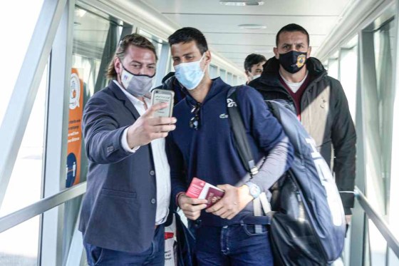 CPA man takes a selfie with Novak Djokovic after he arrived in Belgrade, Serbia. (Darko Bandic / The Associated Press)