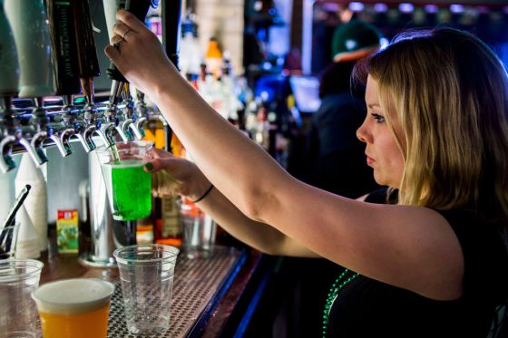 CPA bartender pours a green beer on a past St. Patrick's Day. (Jake May / Flint Journal via The Associated Press files)