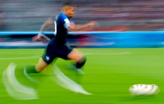France's Kylian Mbappe runs with the ball during the semifinal match with Belgium. (Petr David Josek / The Associated Press)