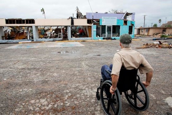 Courtney Sacco/Corpus Christi Caller-Times Texas Gov. Greg Abbott looks over destroyed stores in Rockport during a tour of areas damaged by Hurricane Harvey, on Monday.