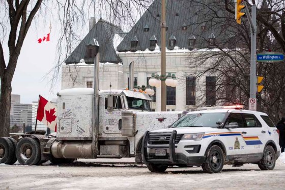 CPA protester’s semi-truck cab and an RCMP vehicle outside the Supreme Court of Canada in Ottawa on Sunday. (Justin Tang / The Canadian Press)