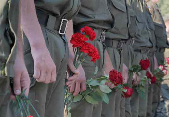 Efrem Lukatsky / The Associated PressUkrainian soldiers wait for their turn to pay the last tribute to a coffin bearing the body of National Guard soldier Igor Derbin who was killed in a Monday clash, at a military base in Novi Petrivtsi outside Kiev, Ukraine, Wednesday.