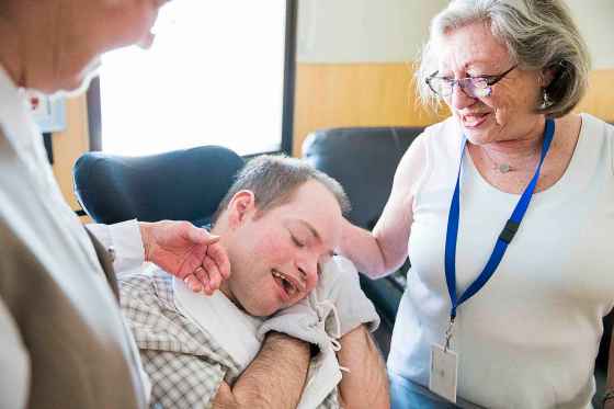 St. Amant centre resident Jonathan Faircloth, and mother Doreen Draffin laugh together in the newly renovated St. Amant living space in Winnipeg.