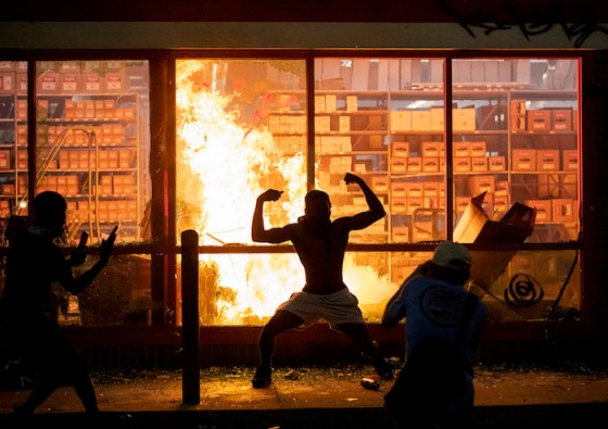 Carlos Gonzalez / Minneapolis Star Tribune / TNSA fire burns at an AutoZone store in Minneapolis on Wednesday, as protesters demonstrate against the death of George Floyd in a confrontation with Minneapolis police on Monday evening.