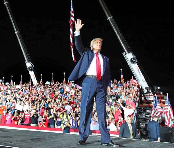 Tribune Media TNSU.S. President Donald Trump waves goodbye to cheering supporters as he departs his campaign rally at Orlando Sanford International Airport in on Monday in Sanford, Fla.  (JOE BURBANK / ORLANDO SENTINEL . TNS)