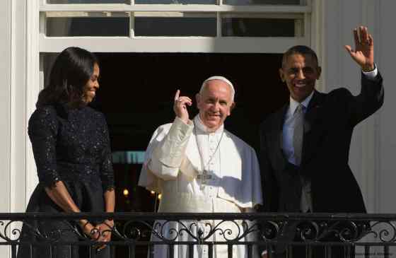 L'Osservatore Romano / Pool Photo via The Associated PressU.S. President Barack Obama (right), first lady Michelle Obama (left) and Pope Francis wave to the crowd on the South Lawn of the White House in Washington Wednesday.
