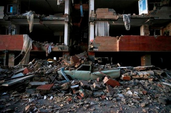 Iranian Students News AgencyA car lays smashed by debris from the earthquake at the city of Sarpol-e-Zahab in western Iran.