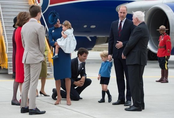 Jonathan Hayward / THE CANADIAN PRESSPrime Minister Justin Trudeau, centre, kneels to talk to Prince George on Satruday.