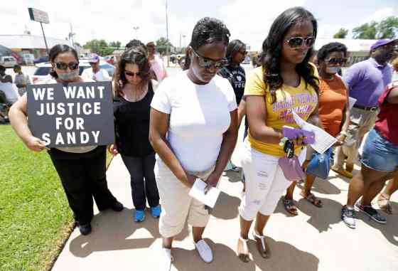 Melissa Phillip / Houston Chronicle via The Associated PressProtesters prayer at rally outside the Waller County Courthouse after a march from the Waller County Jail in Hempstead, Texas, to protest the death of Sandra Bland, who was found dead in the jail.