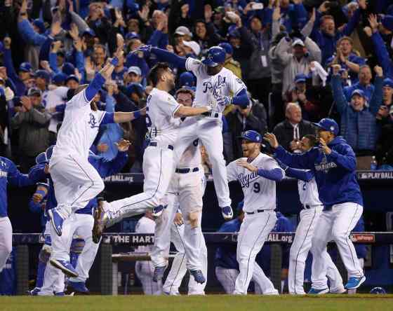 Matt Slocum / The Associated PressKansas City Royals celebrate after Alcides Escobar (2) scored on a sacrifice fly by Eric Hosmer during the 14th inning of Game 1 of the Major League Baseball World Series against the New York Mets Wednesday in Kansas City, Mo.