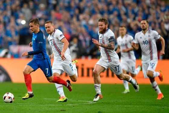 Martin Meissner / The Associated PressFrance's Antoine Griezmann, left, escapes with the ball during the Euro 2016 quarterfinal soccer match between France and Iceland, at the Stade de France in Saint-Denis, north of Paris, France, Sunday.