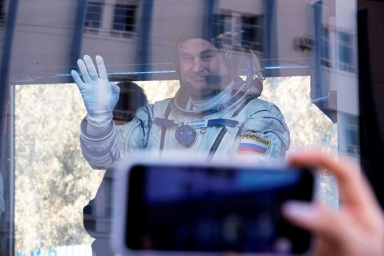 Dmitri Lovetsky / Pool / The Associated PressRussian cosmonaut Alexey Ovchinin, member of the main crew to the International Space Station (ISS), waves to his relatives from a bus prior to the launch of Soyuz-FG rocket at the Russian leased Baikonur cosmodrome, Kazakhstan, Thursday.