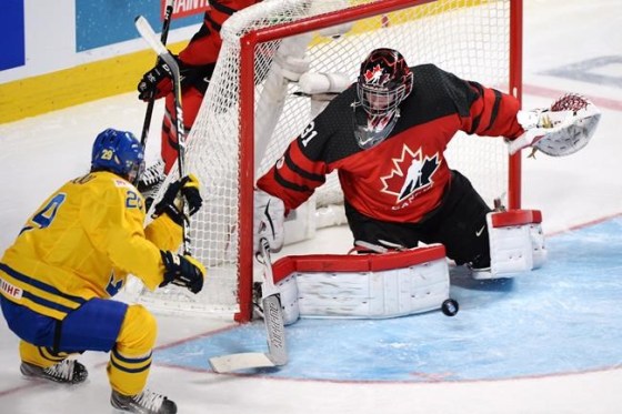 PAUL CHIASSON / THE CANADIAN PRESSCanada's Carter Hart (31) makes a save on Sweden's Tim Soderlund (29) Wednesday.
