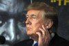 FILE - Former President Donald Trump prepares to provide commentary for a boxing event on Sept. 11, 2021, in Hollywood, Fla. Donald Trump and two of his children, Donald Jr. and Ivanka Trump are due, in the coming days, to face questioning under oath in New York's civil investigation into their business practices. But will the Trumps answer? (AP Photo/Rebecca Blackwell, File)