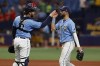 FILE - Tampa Bay Rays center fielder Kevin Kiermaier, right, celebrates with catcher Mike Zunino after defeating the Boston Red Sox in a baseball game April 24, 2022, in St. Petersburg, Fla. Rays standouts Kiermaier and Zunino are out for the season because of injuries, another significant blow for the defending AL East champions. (AP Photo/Scott Audette, File)