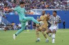 Juventus goalkeeper Wojciech Szczęsny (1) clears the ball away from Barcelona forward Pierre Emeric Aubameyang as Juventus defender Danilo Da Silva applies pressure during the first half of a soccer match at the Cotton Bowl, Tuesday, July 26, 2022 in Dallas. (AP Photo/Jeffrey McWhorter)