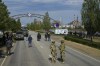 FILE - Russian servicemen stand on the road towards the Zaporizhzhia Nuclear Power Station in territory under Russian military control, southeastern Ukraine, May 1, 2022. Ukrainian guerrillas have increasingly challenged the Russian hold on areas in southeastern Ukraine, attacking local Moscow-backed officials, blowing up key infrastructure and spotting targets for the Ukrainian military. This photo was taken during a trip organized by the Russian Ministry of Defense. (AP Photo, File)