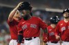 Boston Red Sox's Jackie Bradley Jr., centre, celebrates his two-run home run with Christian Vazquez, left, during the fourth inning of the team's baseball game against the Toronto Blue Jays in Boston, Friday, July 22, 2022. The Toronto Blue Jays have have signed the outfielder to a one-year major-league contract. THE CANADIAN PRESS/AP-Michael Dwyer