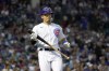 Chicago Cubs' Seiya Suzuki reacts to a foul ball during the third inning of the team's baseball game against the Washington Nationals Tuesday, Aug. 9, 2022, in Chicago. (AP Photo/Charles Rex Arbogast)