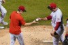 Cincinnati Reds relief pitcher Joel Kuhnel hands the ball to manager David Bell during the seventh inning of the team's baseball game against the New York Mets on Tuesday, Aug. 9, 2022, in New York. The Mets won 6-2. (AP Photo/Frank Franklin II)