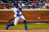 New York Mets' Francisco Lindor swings for a two-run home run against the Cincinnati Reds during the third inning of a baseball game Tuesday, Aug. 9, 2022, in New York. (AP Photo/Frank Franklin II)