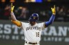Milwaukee Brewers' Kolten Wong reacts after two runs scored on his hit during the fifth inning of a baseball game against the Tampa Bay Rays Tuesday, Aug. 9, 2022, in Milwaukee. (AP Photo/Morry Gash)