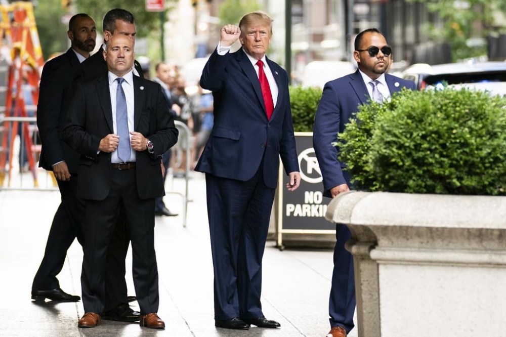 Former President Donald Trump gestures as he departs Trump Tower, Wednesday, Aug. 10, 2022, in New York, on his way to the New York attorney general's office for a deposition in a civil investigation. (AP Photo/Julia Nikhinson)