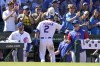 Chicago Cubs manager David Ross, right, greets Nico Hoerner after Horner's homer off Washington Nationals starting pitcher Josiah Gray during the seventh inning of a baseball game Wednesday, Aug. 10, 2022, in Chicago. (AP Photo/Charles Rex Arbogast)
