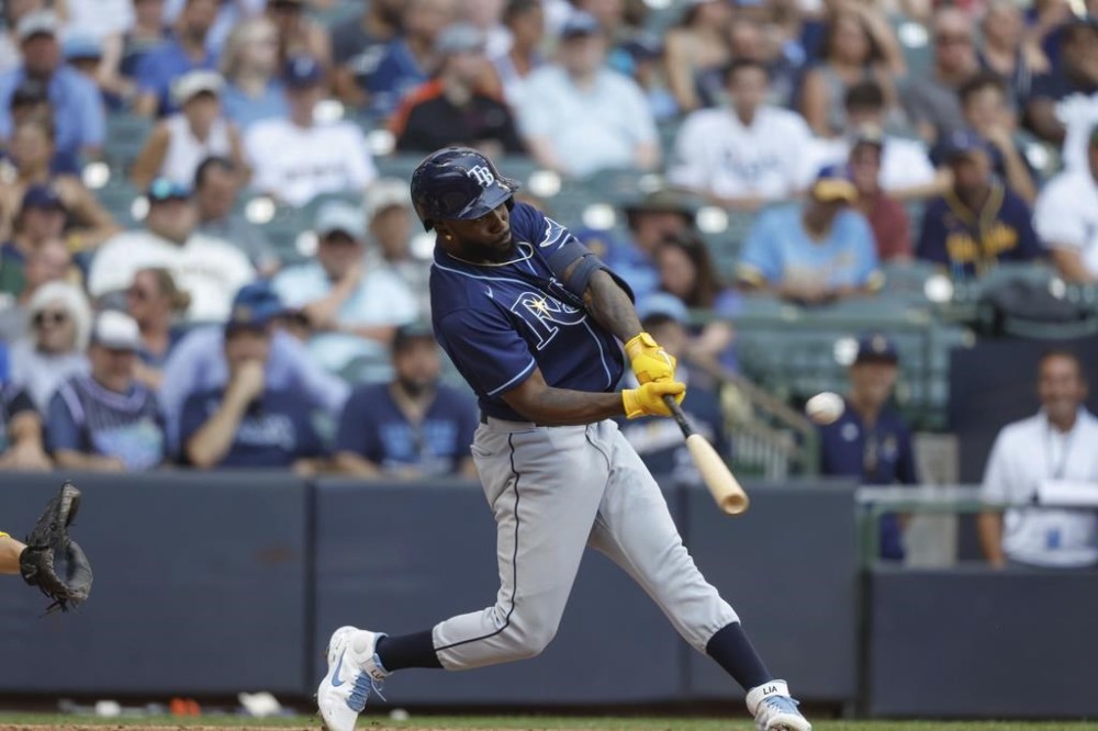 Tampa Bay Rays' Randy Arozarena hits a home run against the Milwaukee Brewers during the seventh inning of an a baseball game Wednesday, Aug. 10, 2022, in Milwaukee. (AP Photo/Jeffrey Phelps)