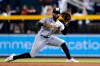 Pittsburgh Pirates second baseman Rodolfo Castro slides over to make a catch on a liner hit by Arizona Diamondbacks' Ketel Marte during the first inning of a baseball game Wednesday, Aug. 10, 2022, in Phoenix. (AP Photo/Ross D. Franklin)