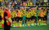 Dortmund's players stand together after the final whistle of the German Bundesliga soccer match between Borussia Dortmund and Bayer Leverkusen in Dortmund, Germany, Saturday, Aug. 6, 2022. (Bernd Thissen/dpa via AP)