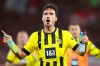 Dortmund's Mats Hummels celebrates after winning in the German Bundesliga soccer match between SC Freiburg and Borussia Dortmund in Freiburg Im Breisgau, Germany, Friday, Aug. 12, 2022. (Tom Weller/dpa via AP)