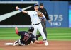 Toronto Blue Jays third baseman Matt Chapman throws to first base, too late to complete a double play on Cleveland Guardians centre fielder Will Benson after forcing out Austin Hedges (11) at second base in fourth inning American League baseball action in Toronto on Friday, August 12, 2022. THE CANADIAN PRESS/Jon Blacker