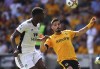 Wolverhampton Wanderers' Pedro Neto and Fulham's Tosin Adarabioyo vie for the ball during the Premier League match at the Molineux Stadium, Wolverhampton, Saturday Aug. 13, 2022. (David Davies/PA via AP)